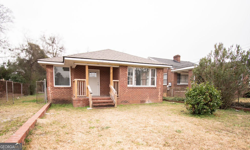 a front view of house with outdoor seating