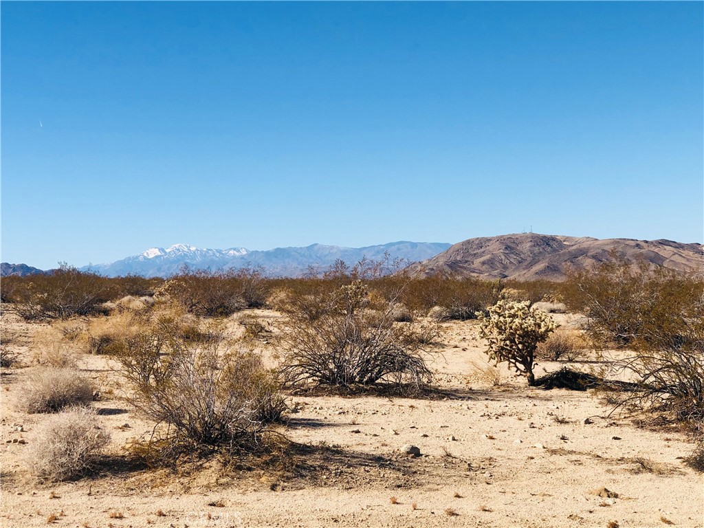 a view of mountain view with mountains in the background