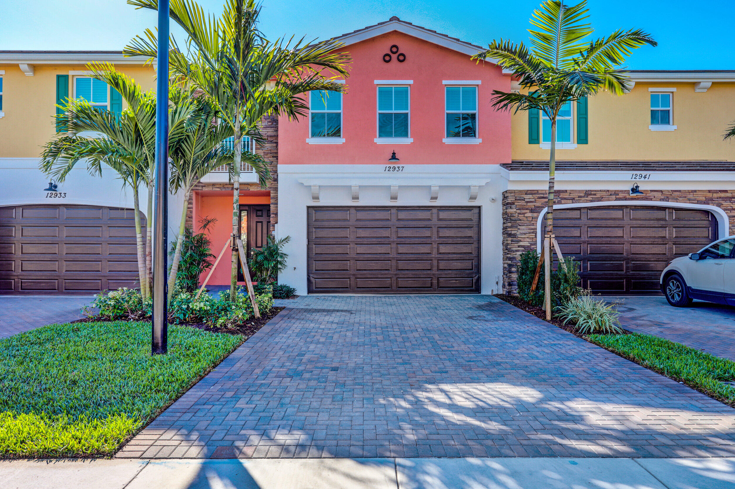 a front view of a house with a yard