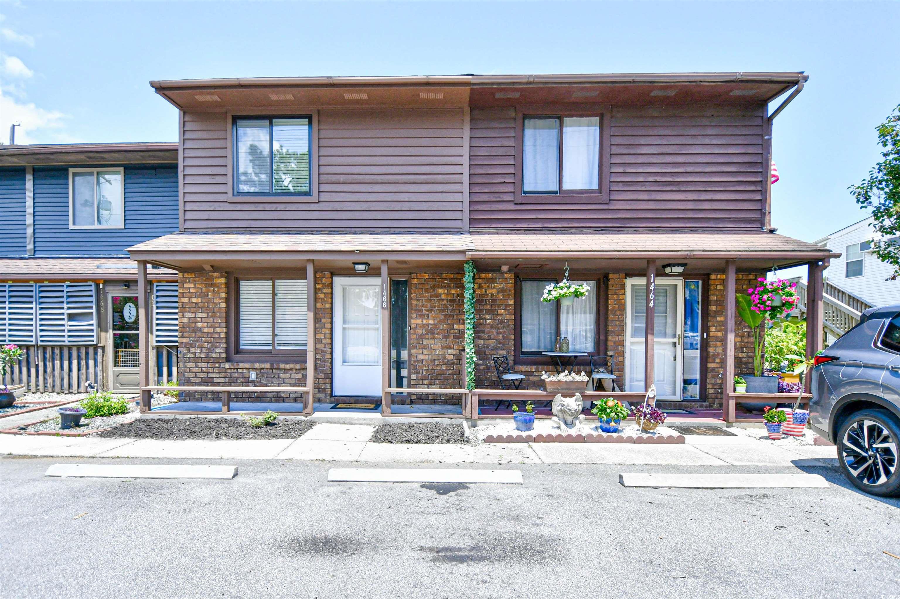 View of front of house with covered porch