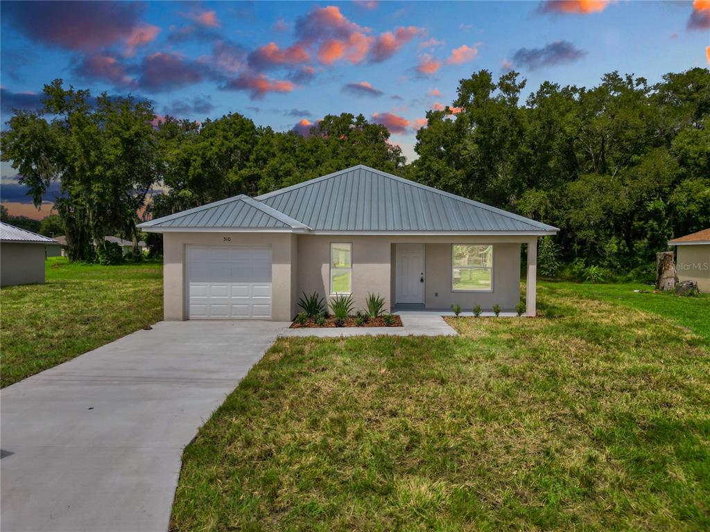 front view of a house with a yard