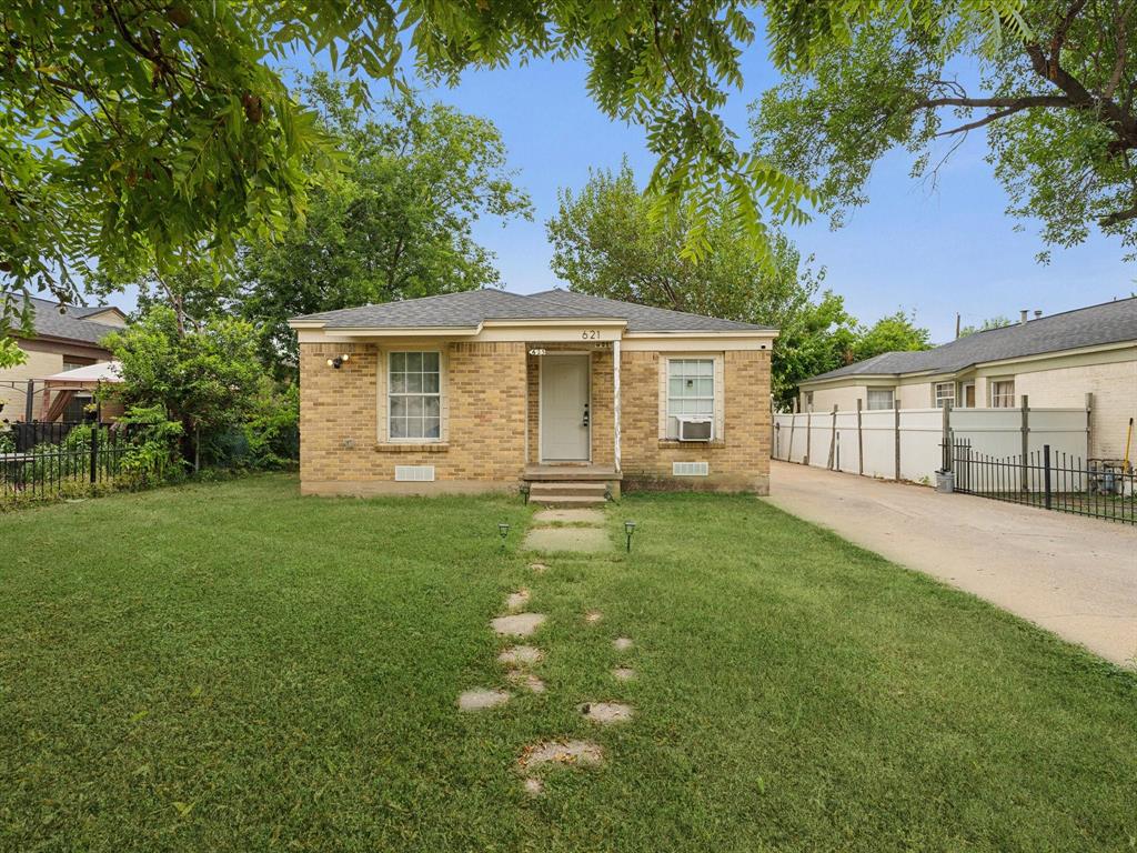 front view of a house with a yard