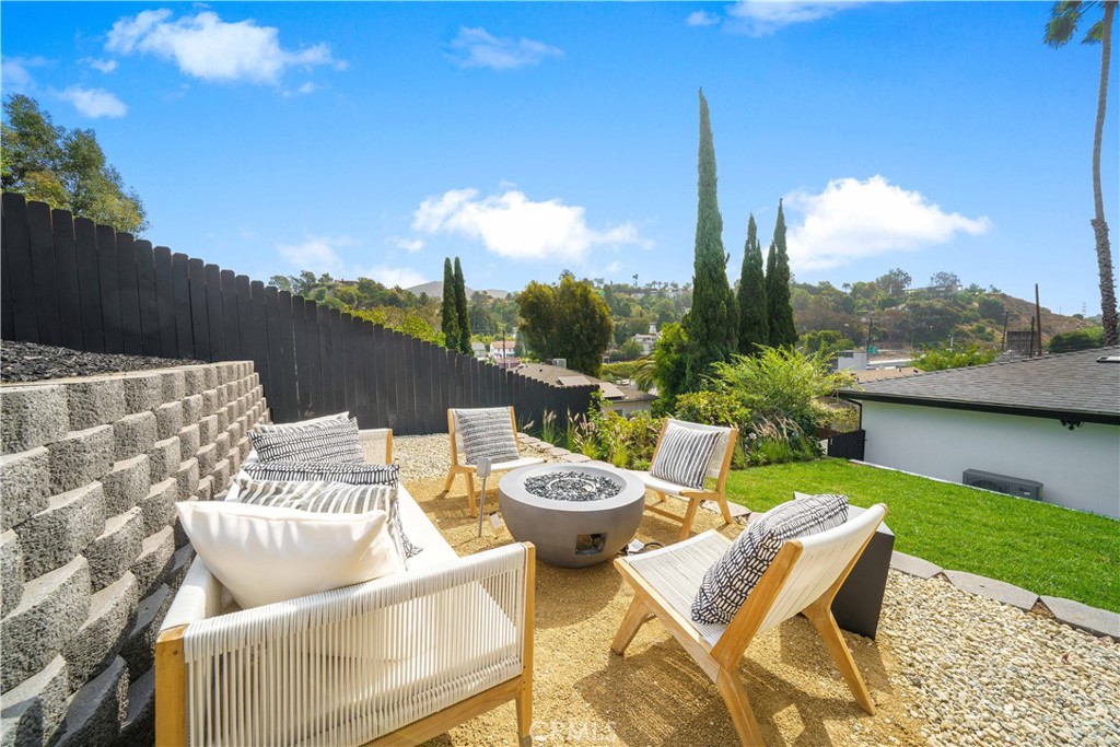 a view of a terrace with furniture and garden