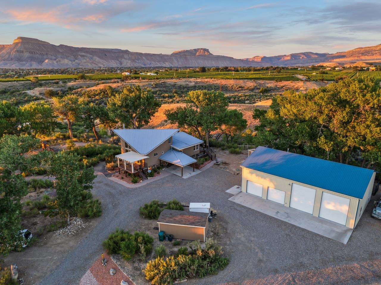 an aerial view of a house with a lake view