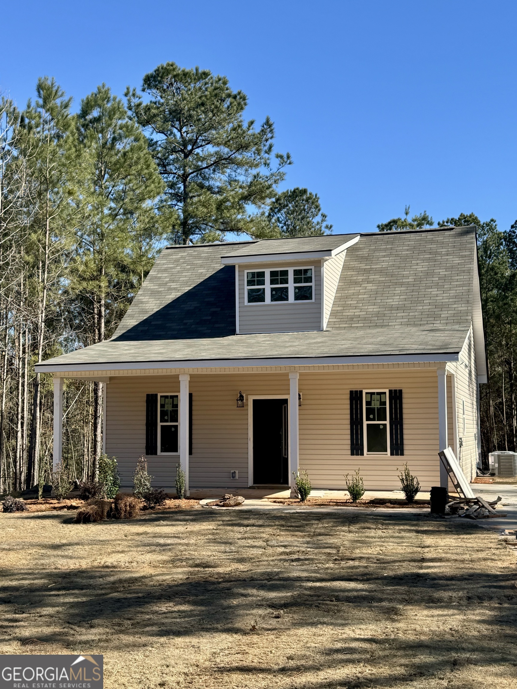 front view of a house with a yard