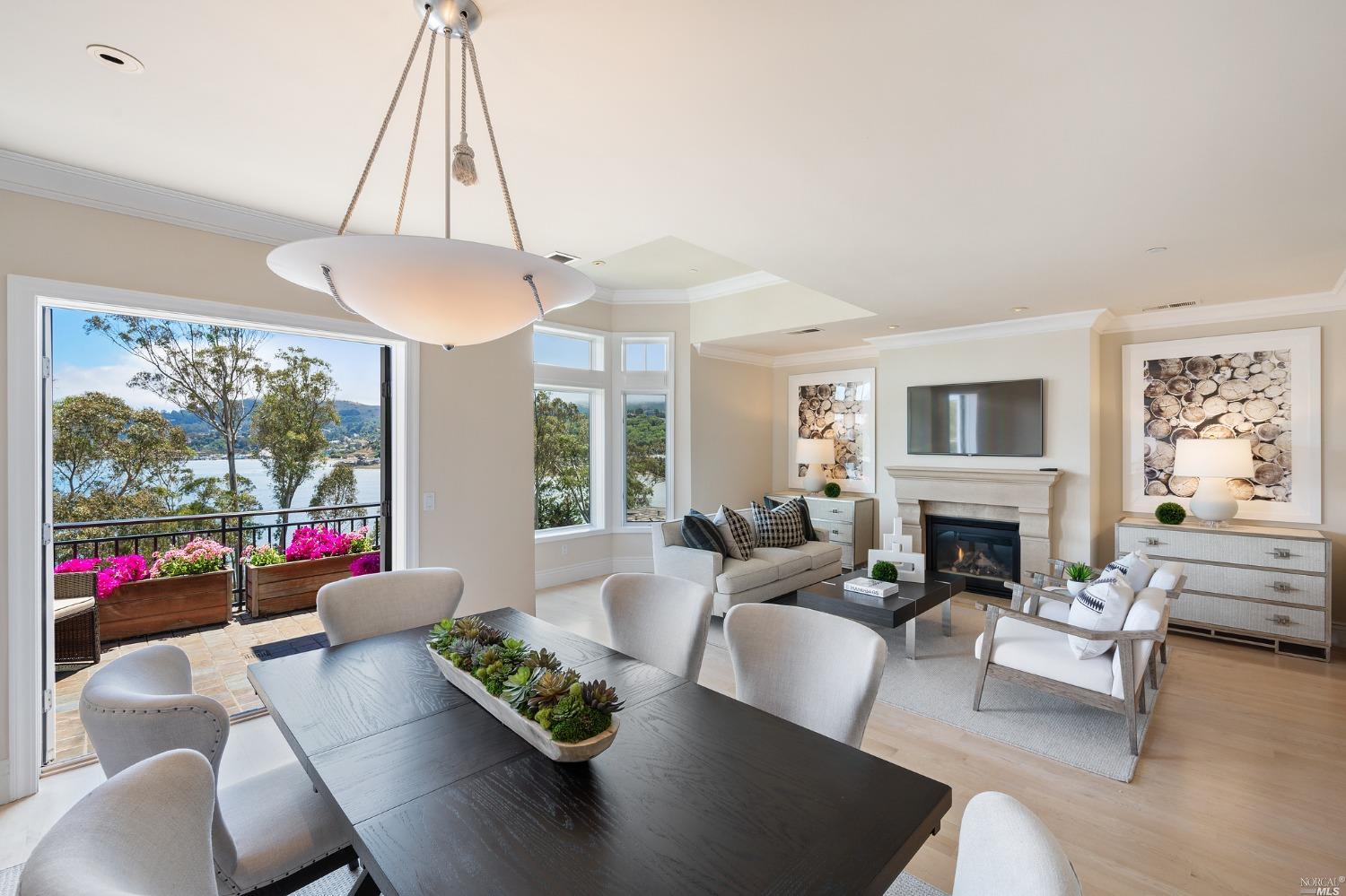 a living room with furniture and a floor to ceiling window