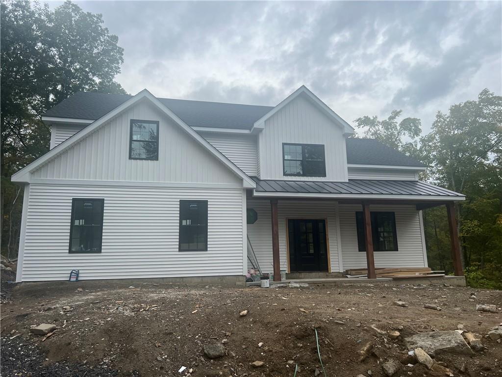 Modern inspired farmhouse with a porch