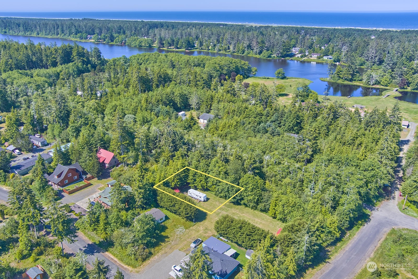 an aerial view of a houses with a yard