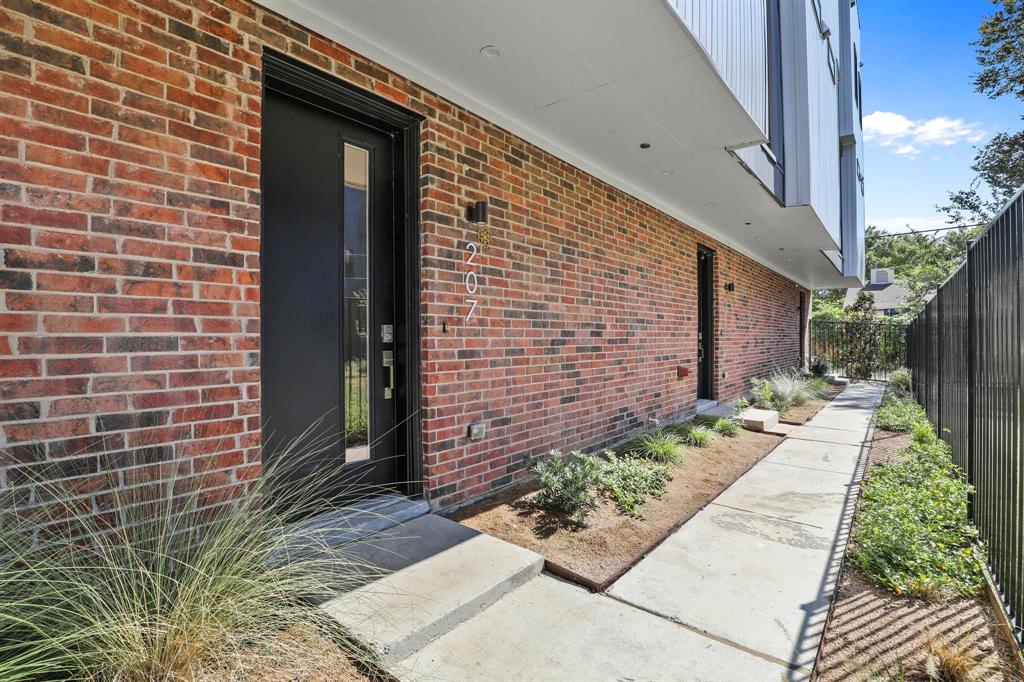 a backyard of a house with outdoor seating