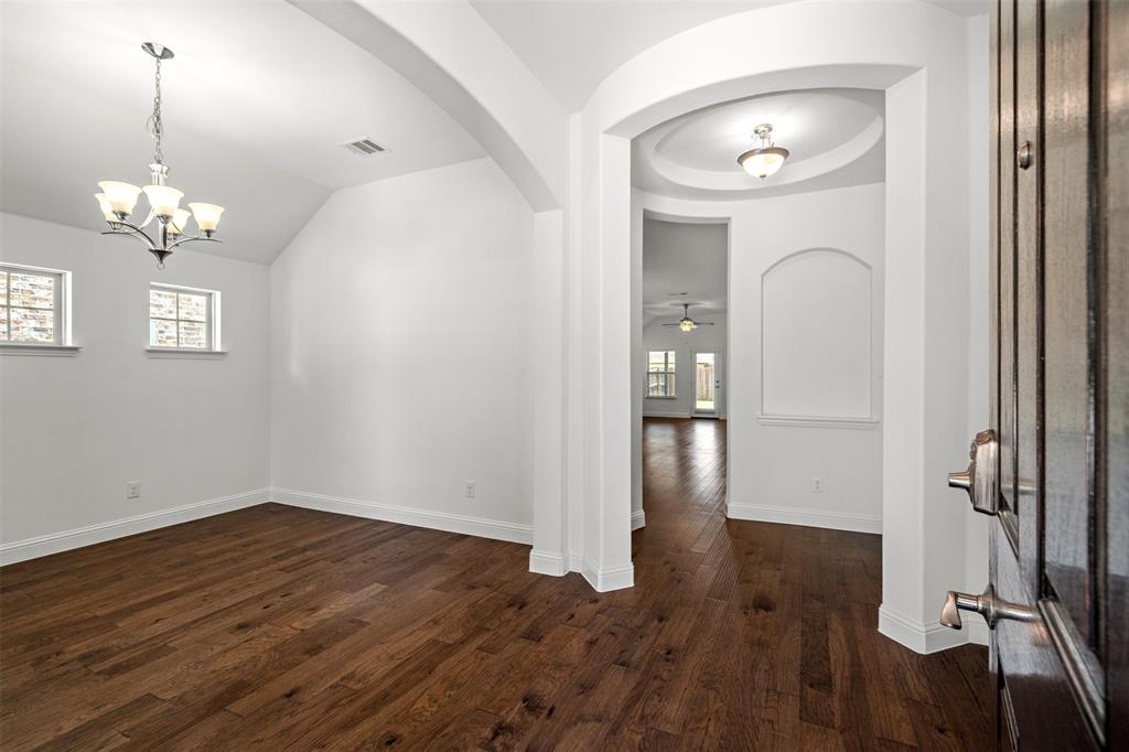 a view of a livingroom with wooden floor