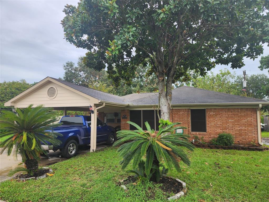 a front view of house with yard and outdoor seating