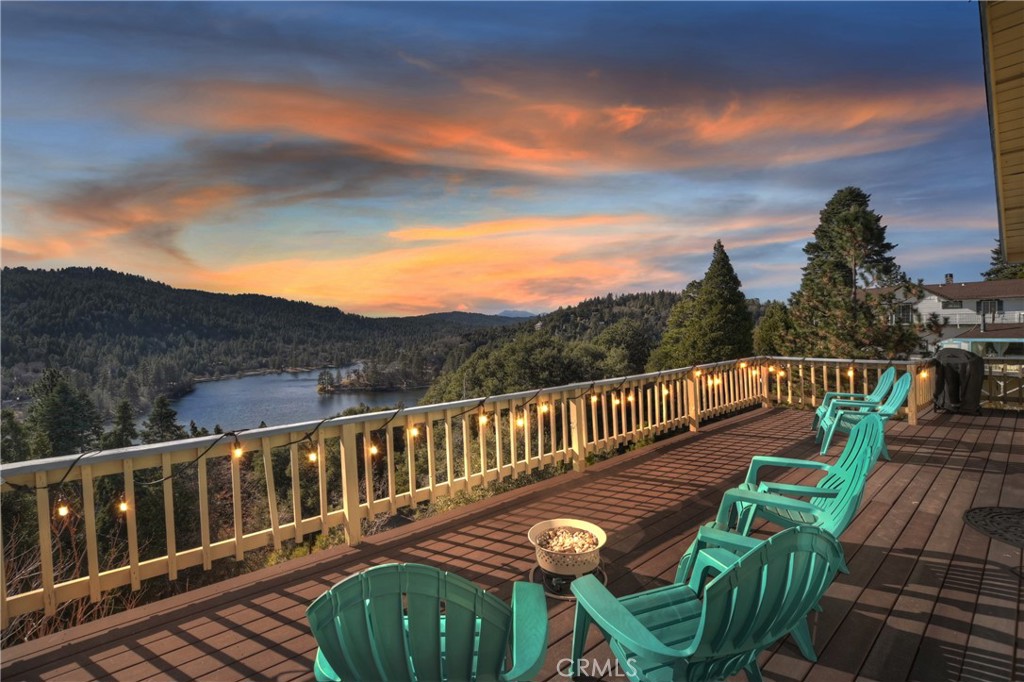 a view of a balcony with outdoor seating