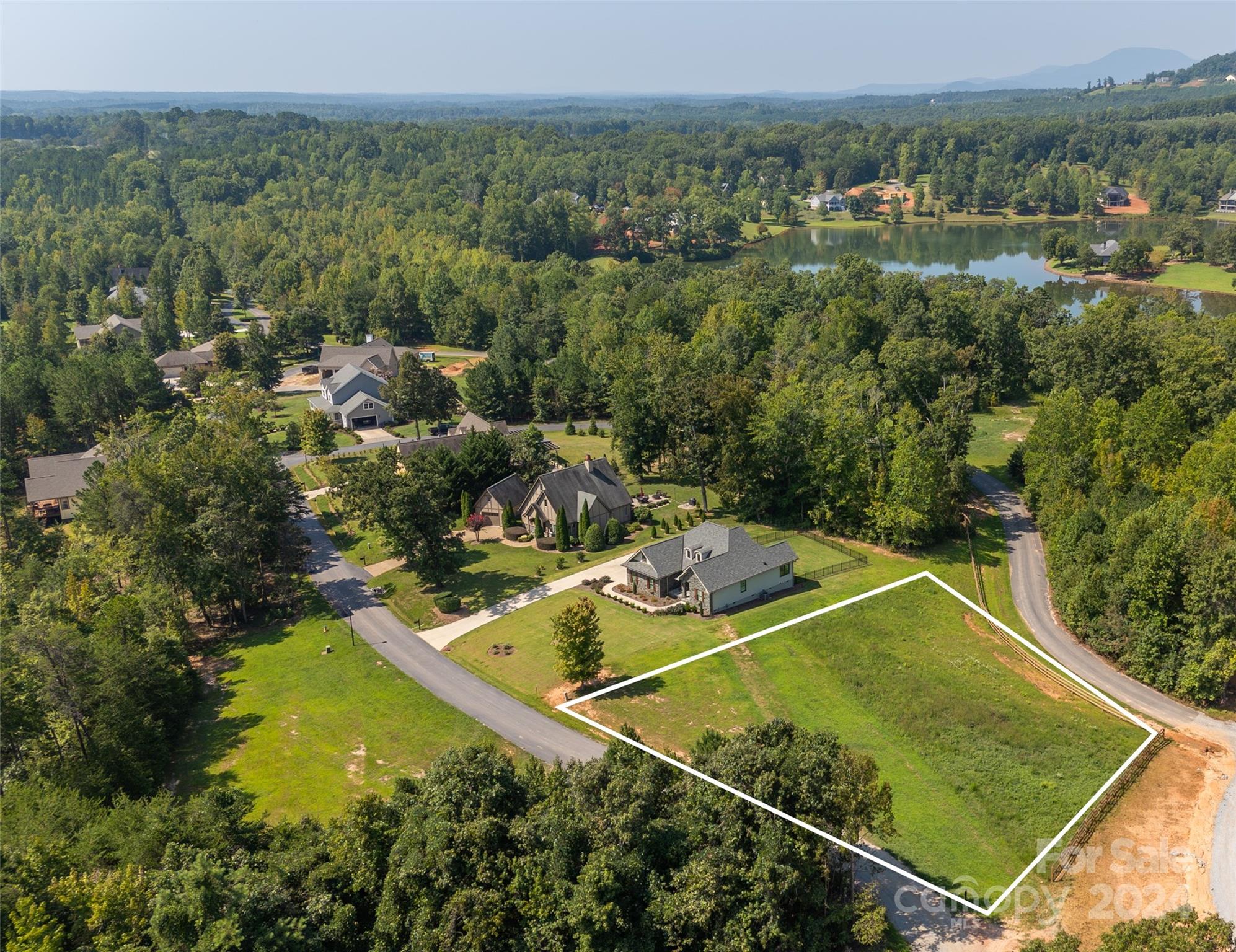 an aerial view of a house with a garden