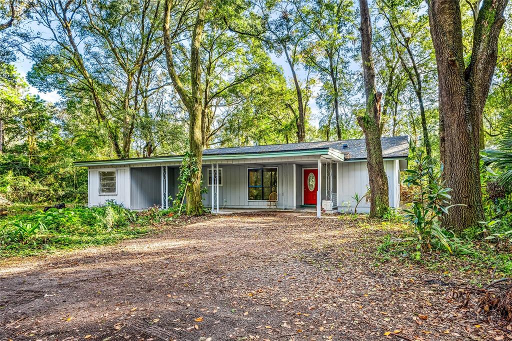 front view of a house with a trees