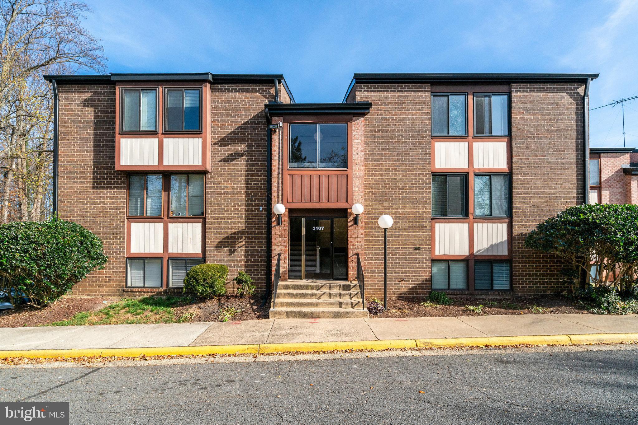 a view of a brick house with a large windows