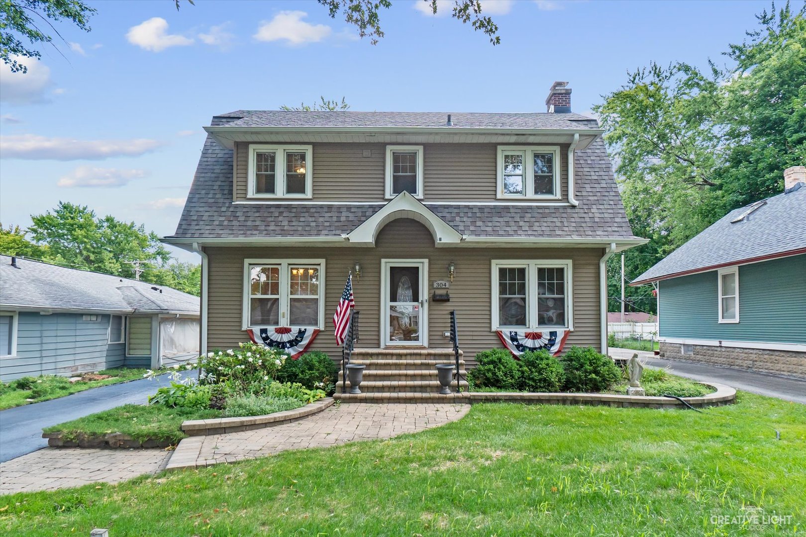 a front view of a house with garden