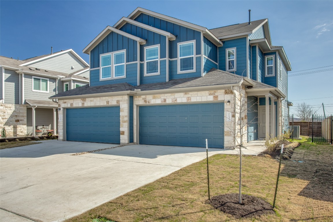 a front view of a house with garage