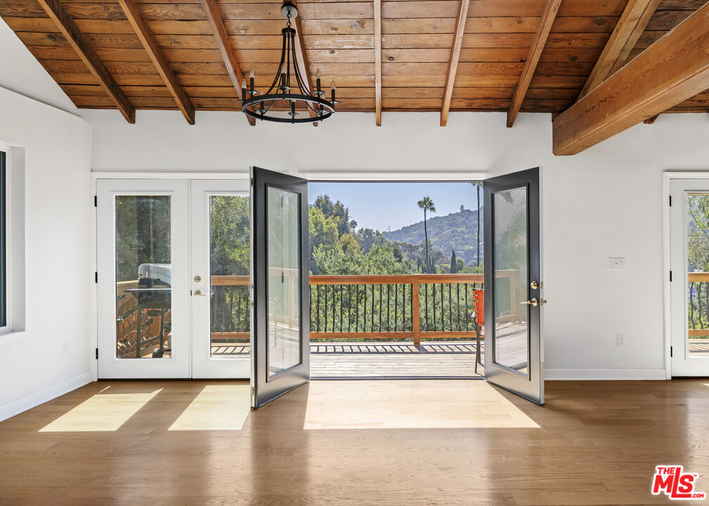 a view of a room with wooden walls