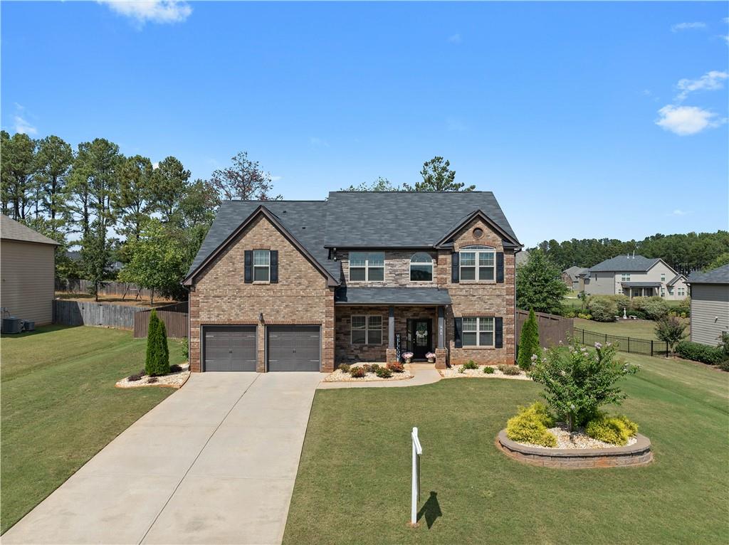 a front view of a house with a yard