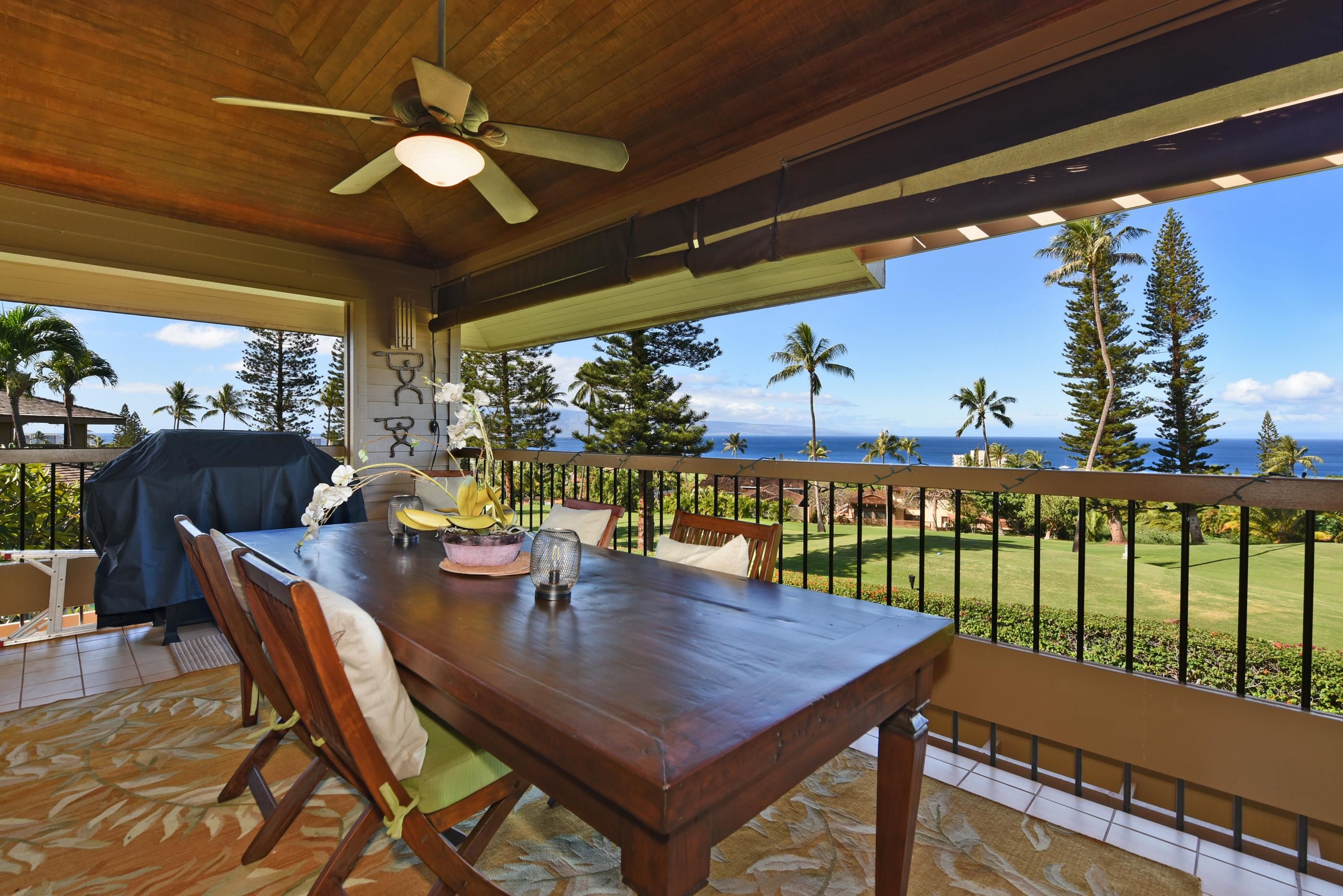 a view of a dining table and chairs in the balcony