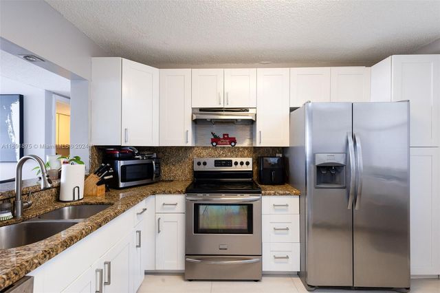 $275,000 | 2907 Carambola Circle South, Unit 105 | Applewood Village IV