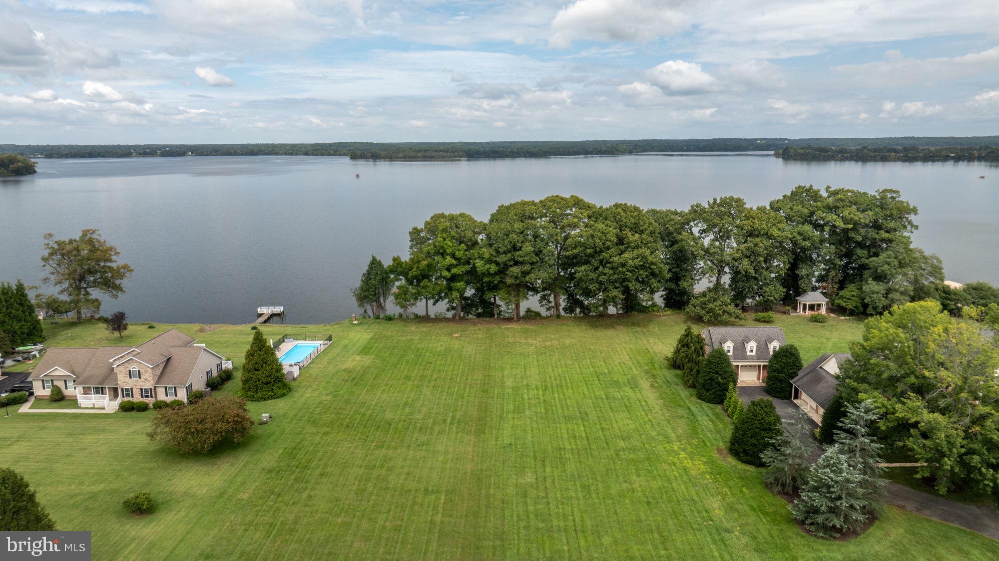 a view of a lake with a yard