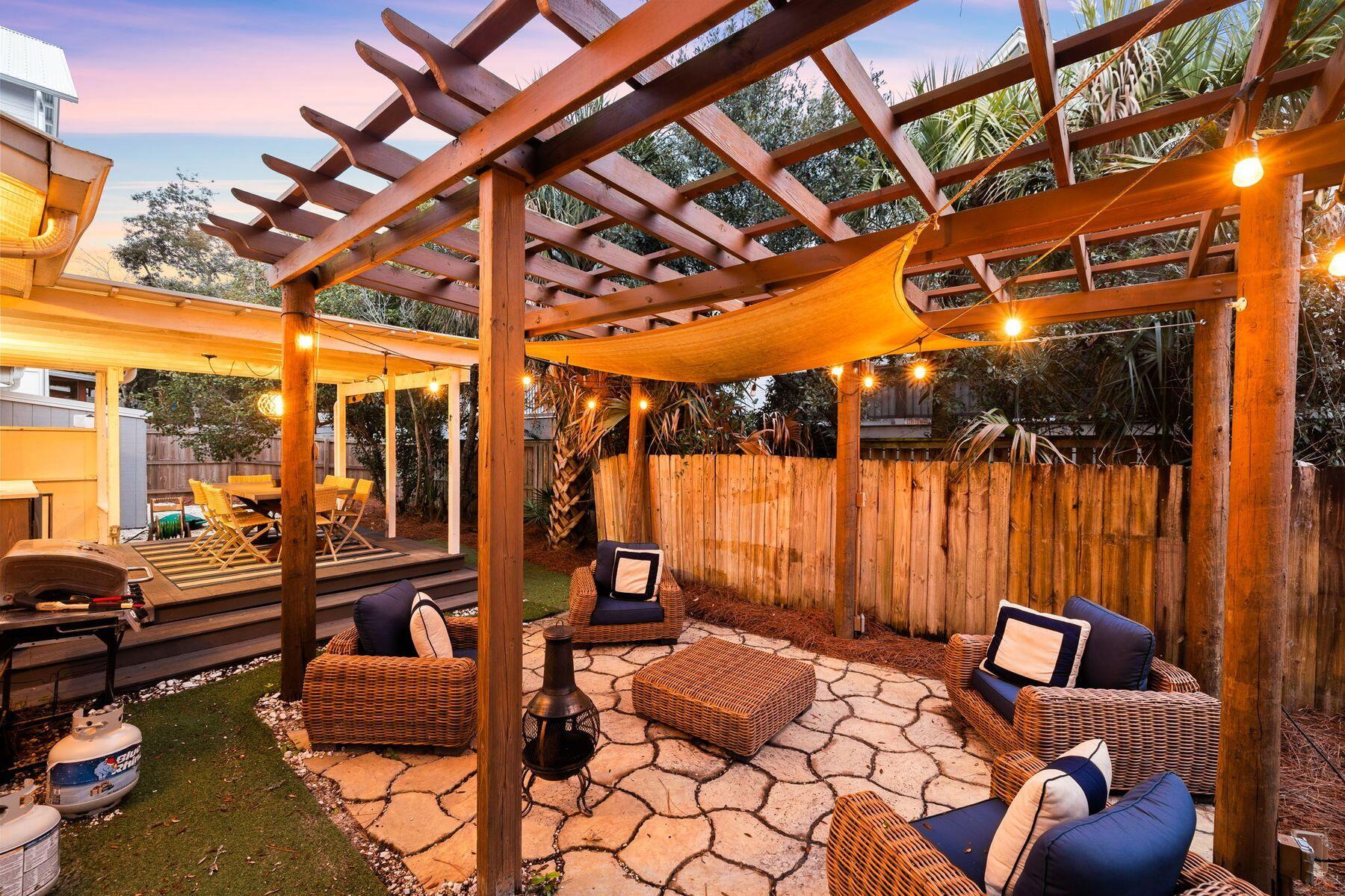 a outdoor space with patio lots of furniture and iron fence