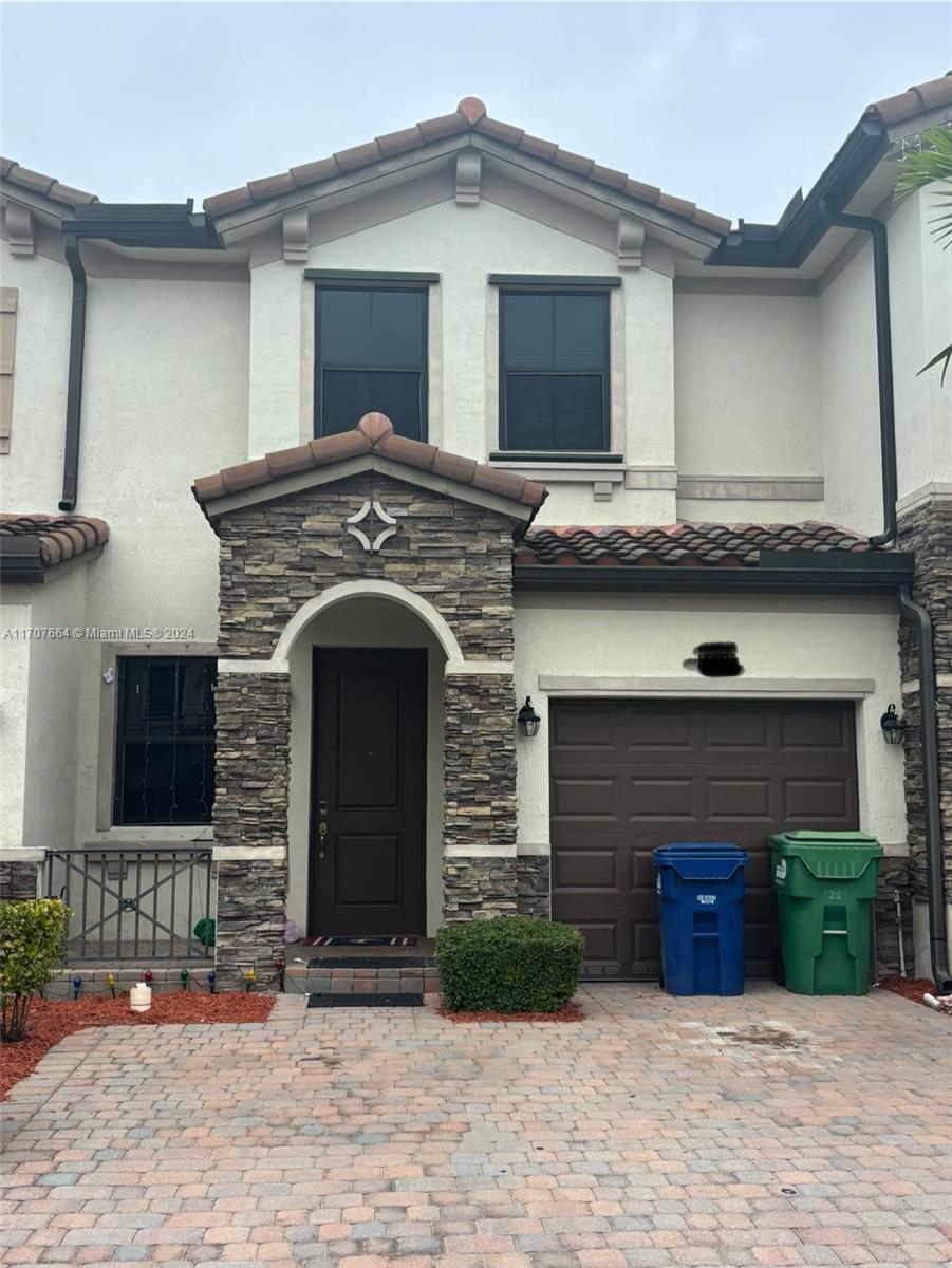 a front view of a house with yard