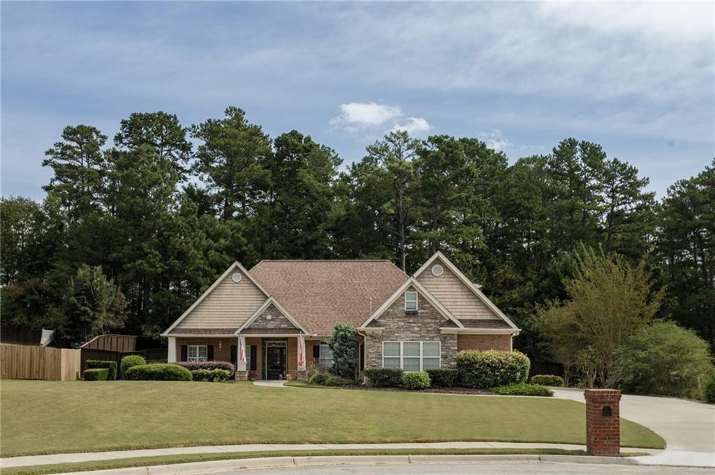 a view of house with outdoor space and garden