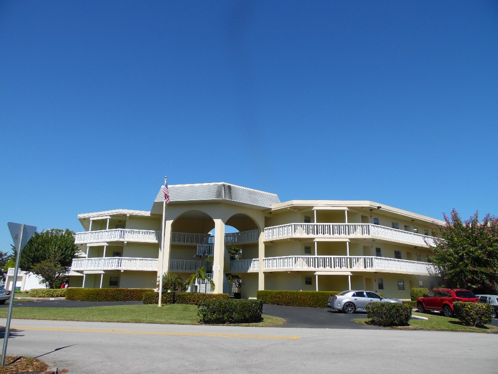 a front view of a building with garden