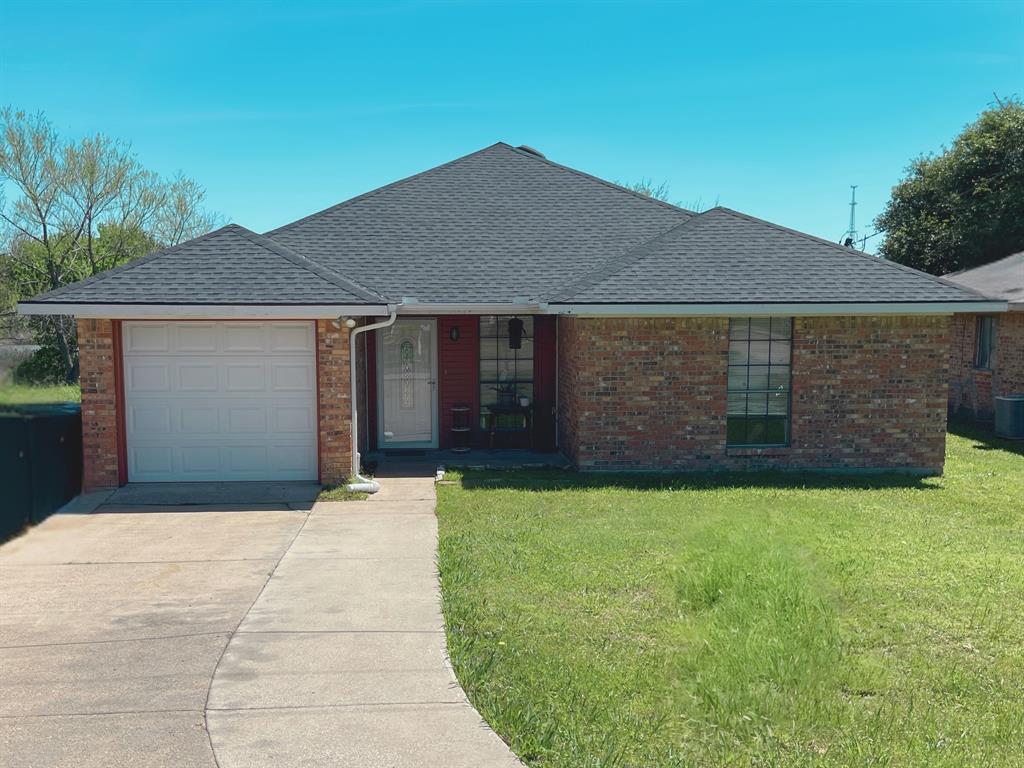 a front view of a house with yard