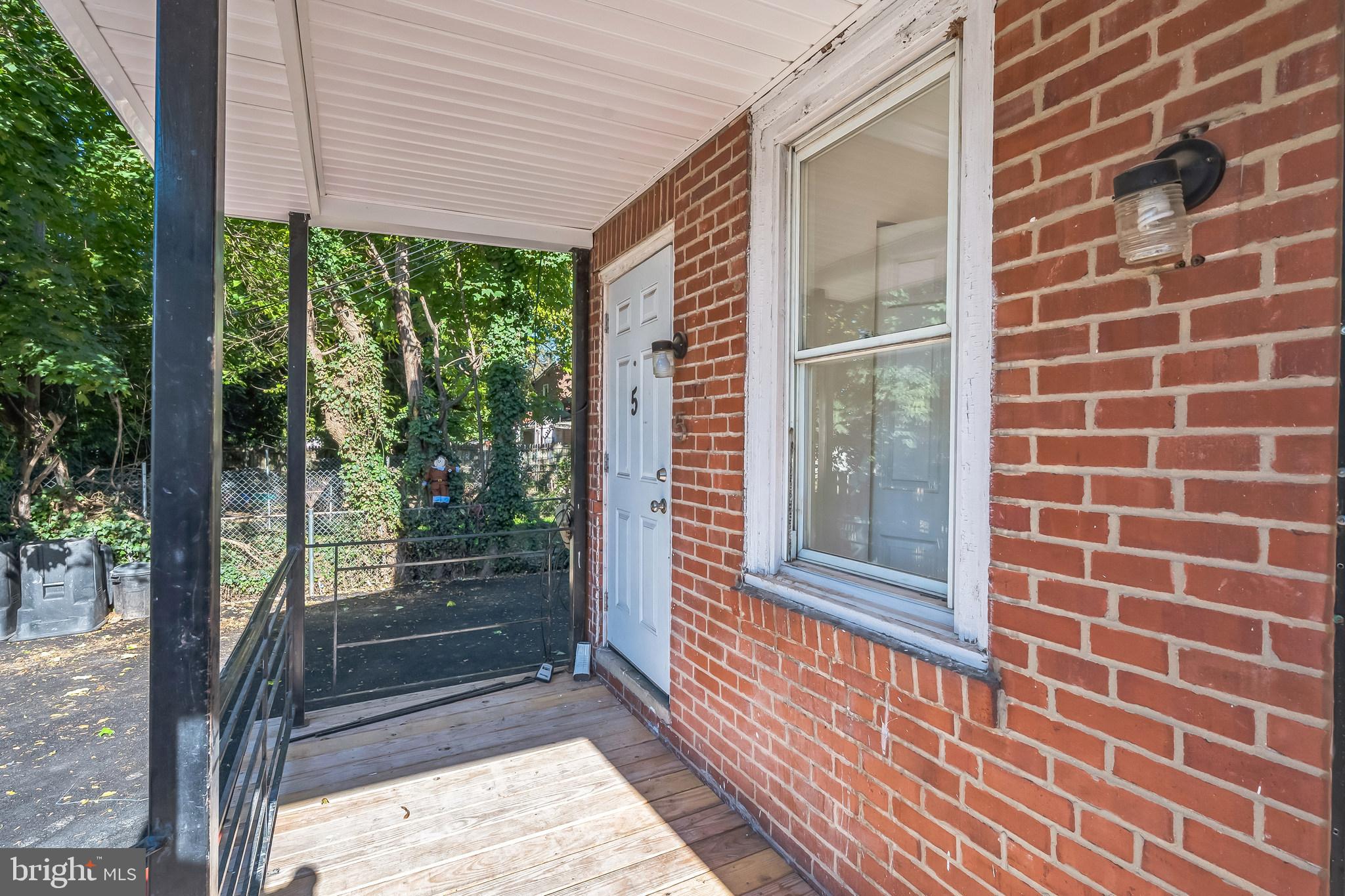 a view of a brick house with a large window