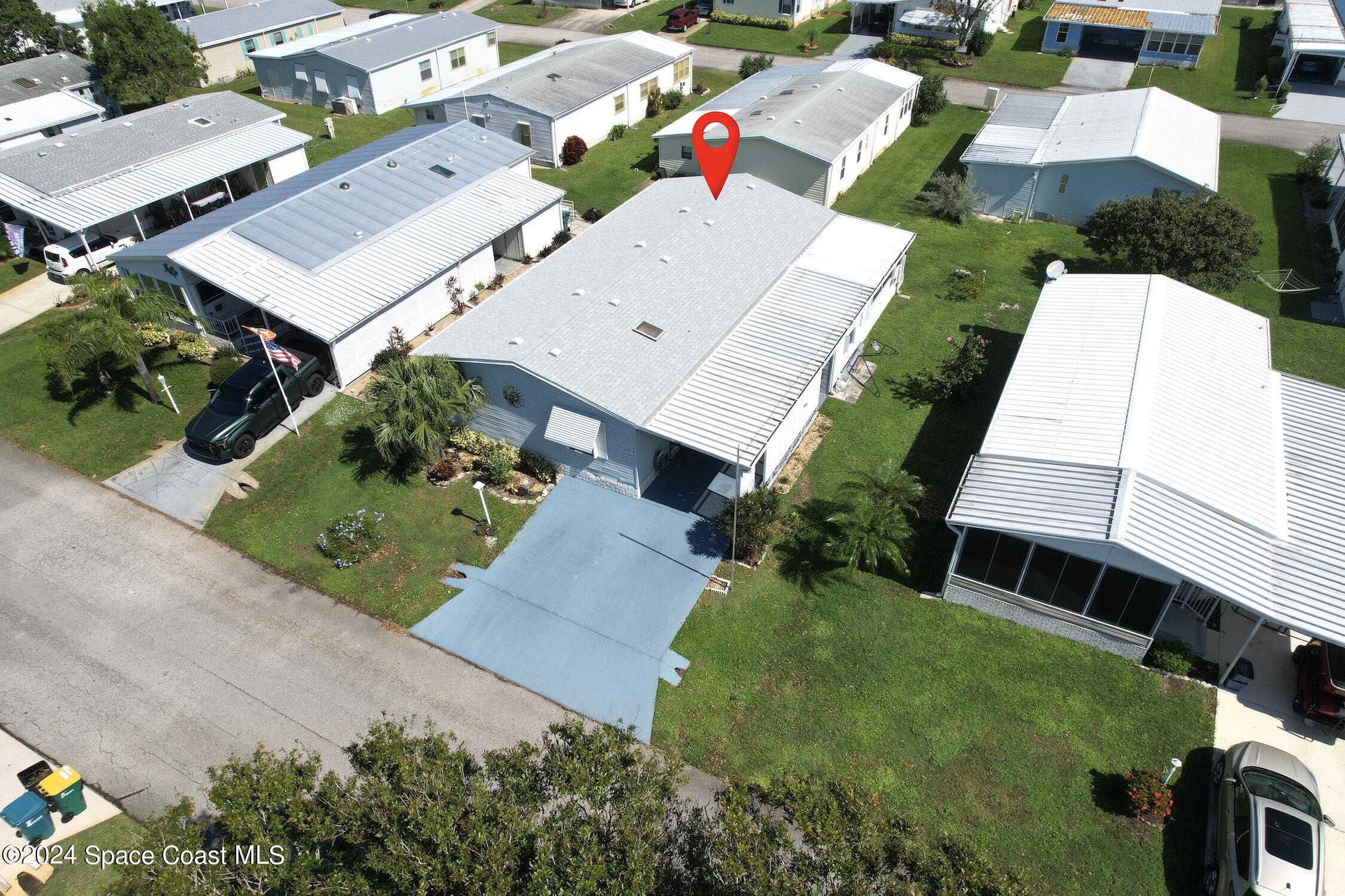 an aerial view of a house with a garden