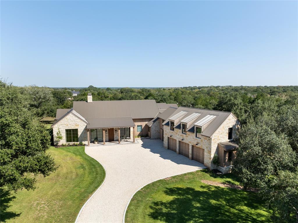 a aerial view of a house with a big yard