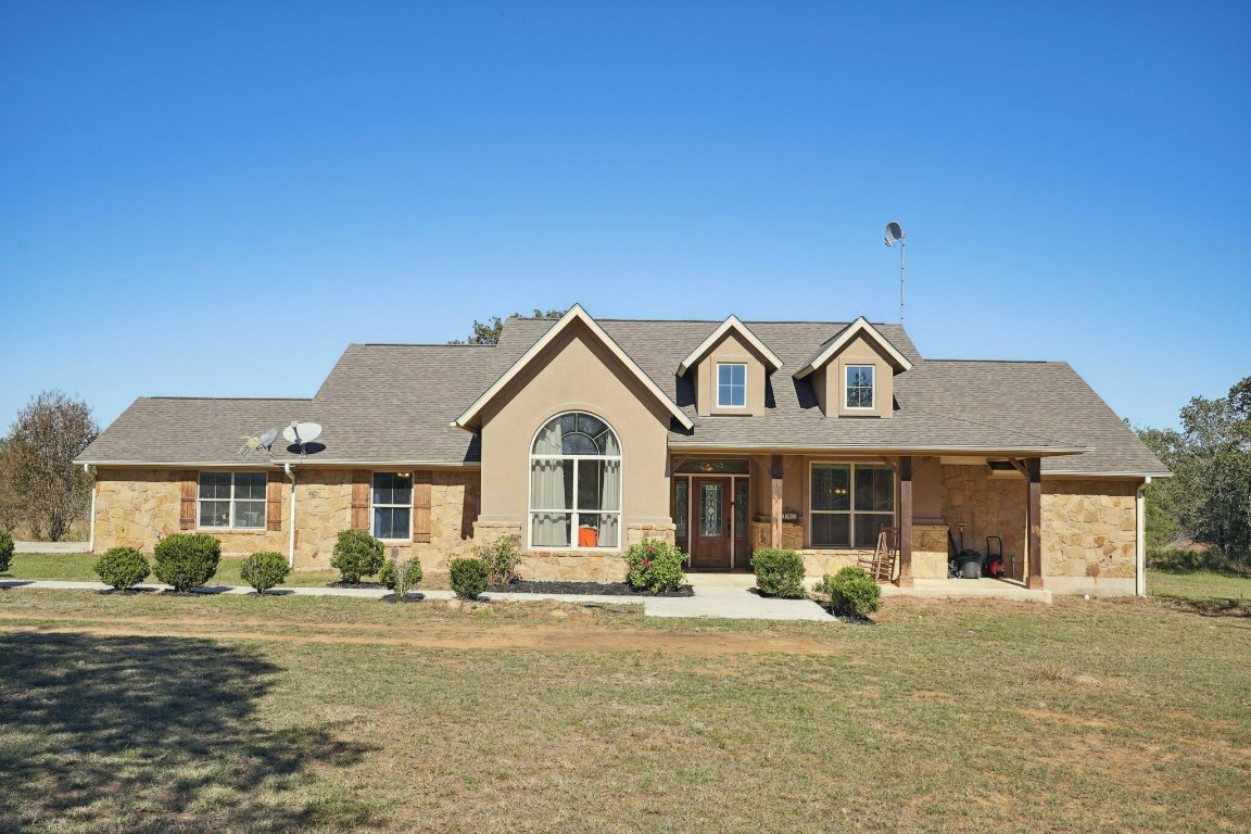 a front view of a house with a yard