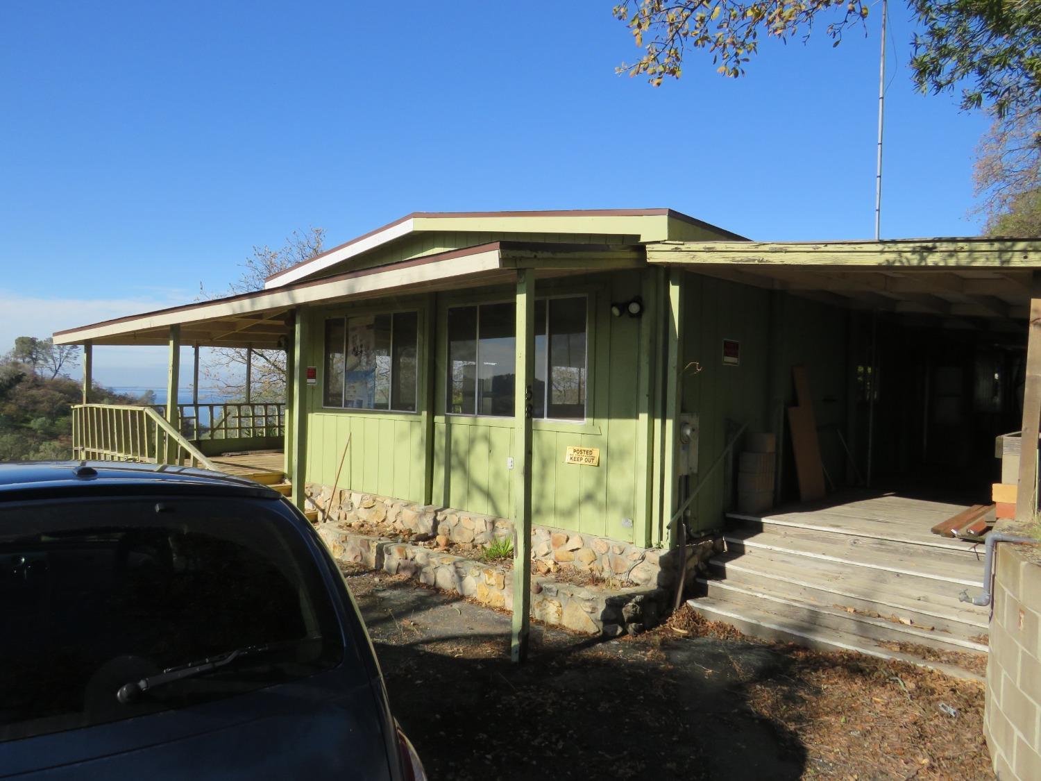 a view of backyard with cabin