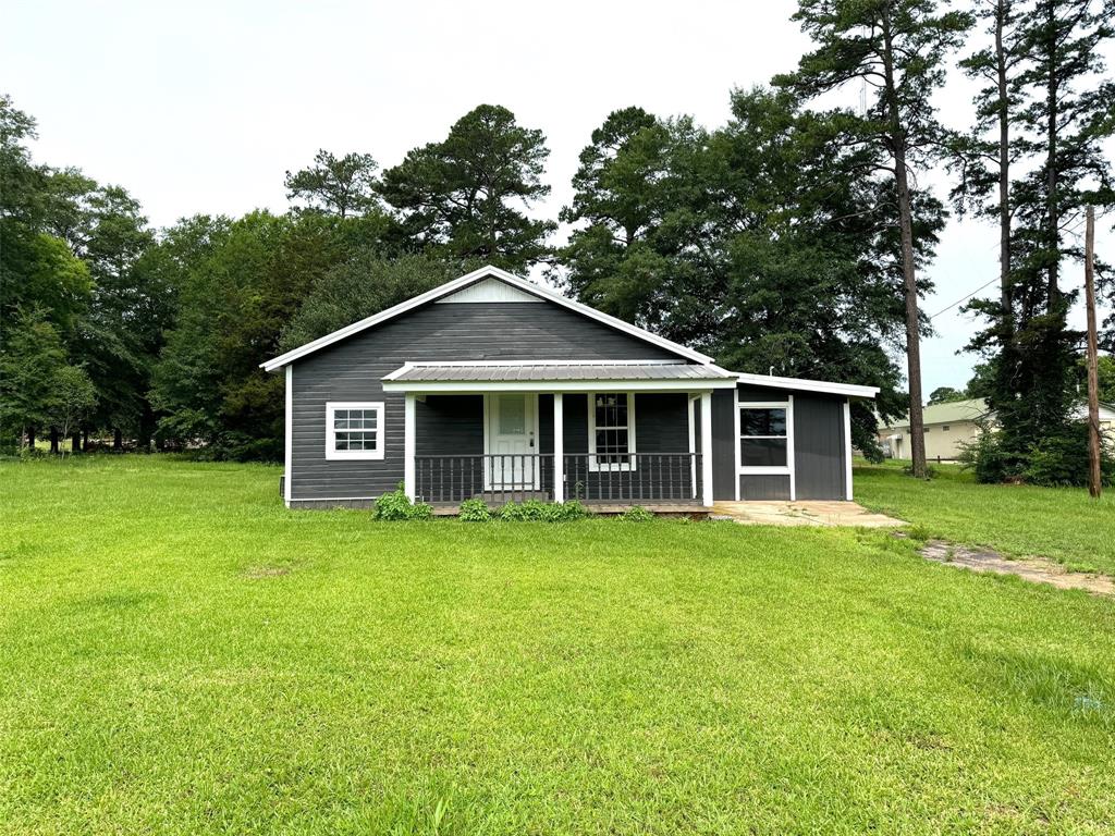 a front of a house with a garden