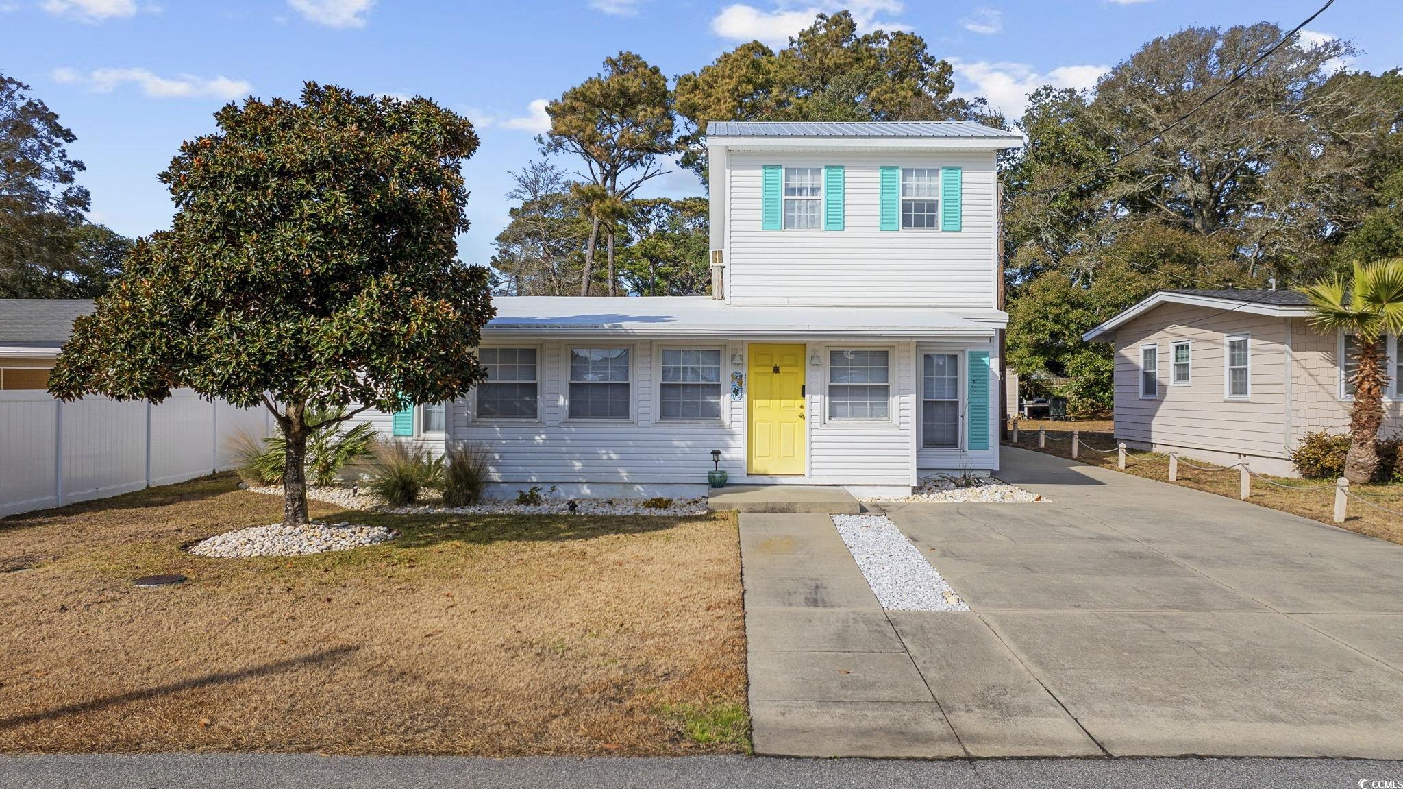 View of front of property with a front yard