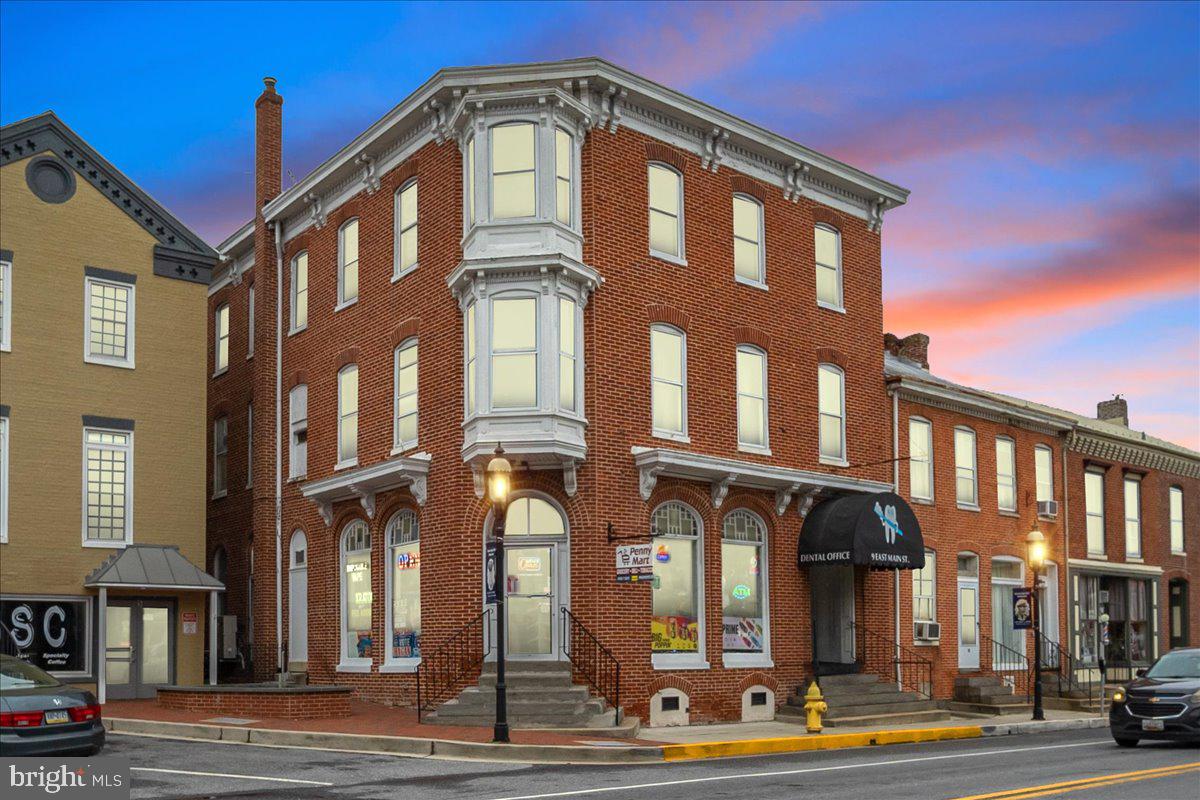 a front view of a building with street view