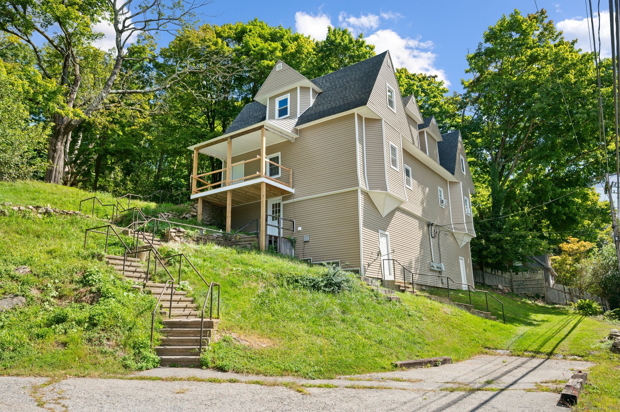 front view of a house with a yard