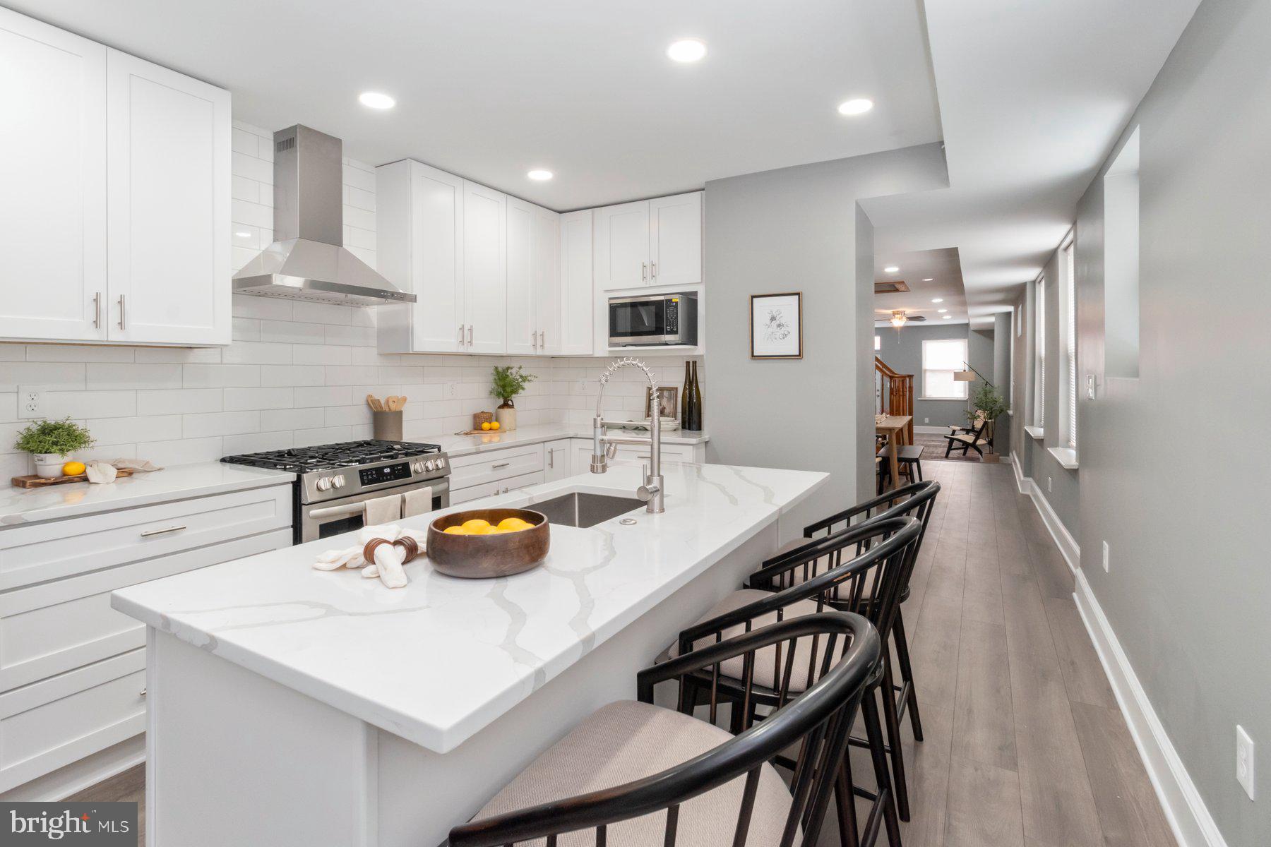 a kitchen with a table chairs and a stove