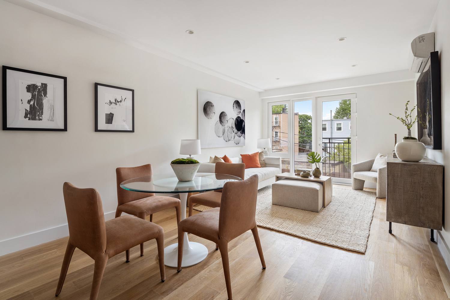 a view of a livingroom with furniture and a flat screen tv