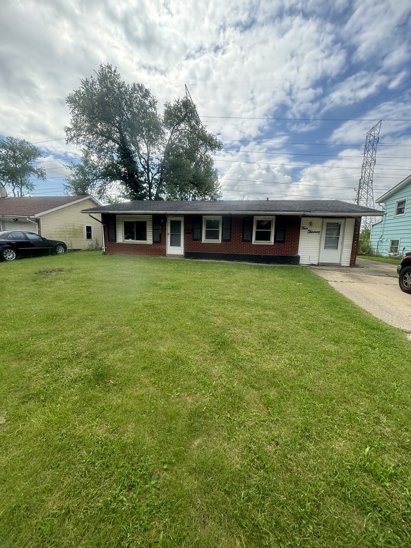 front view of a house with a garden