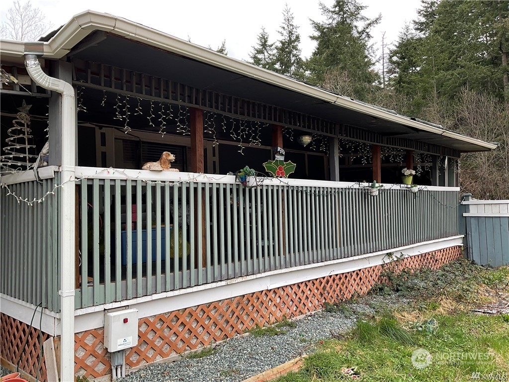 a view of a house with a small deck