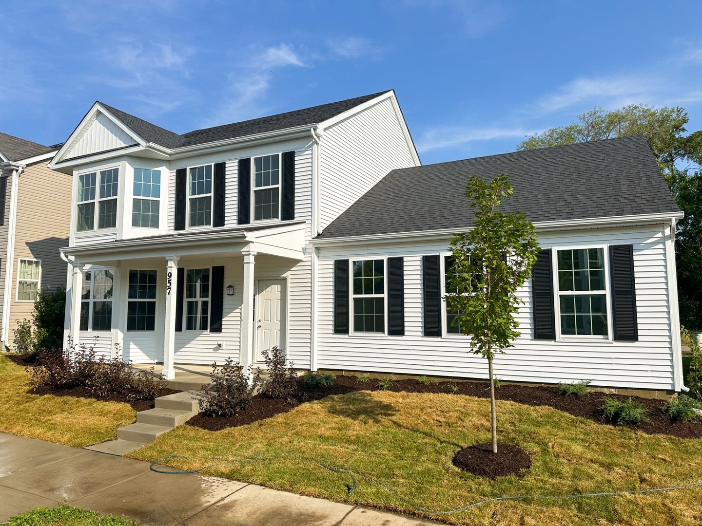 front view of a house with a yard