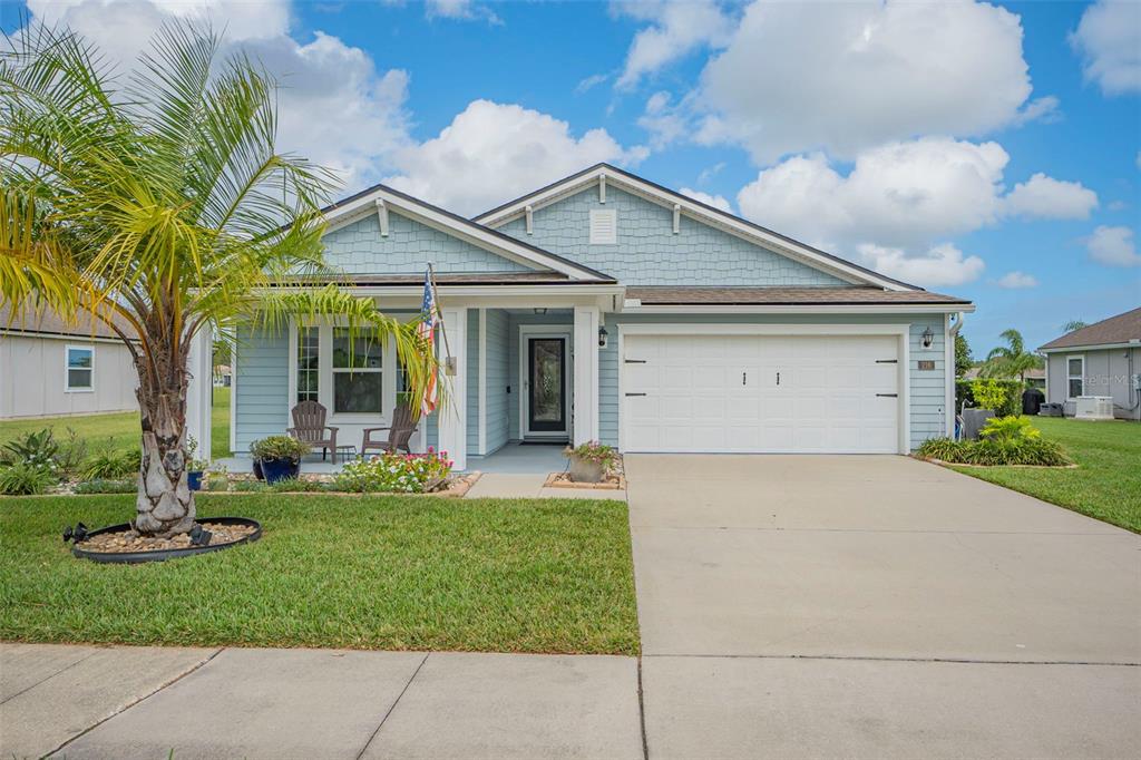 front view of a house with a yard