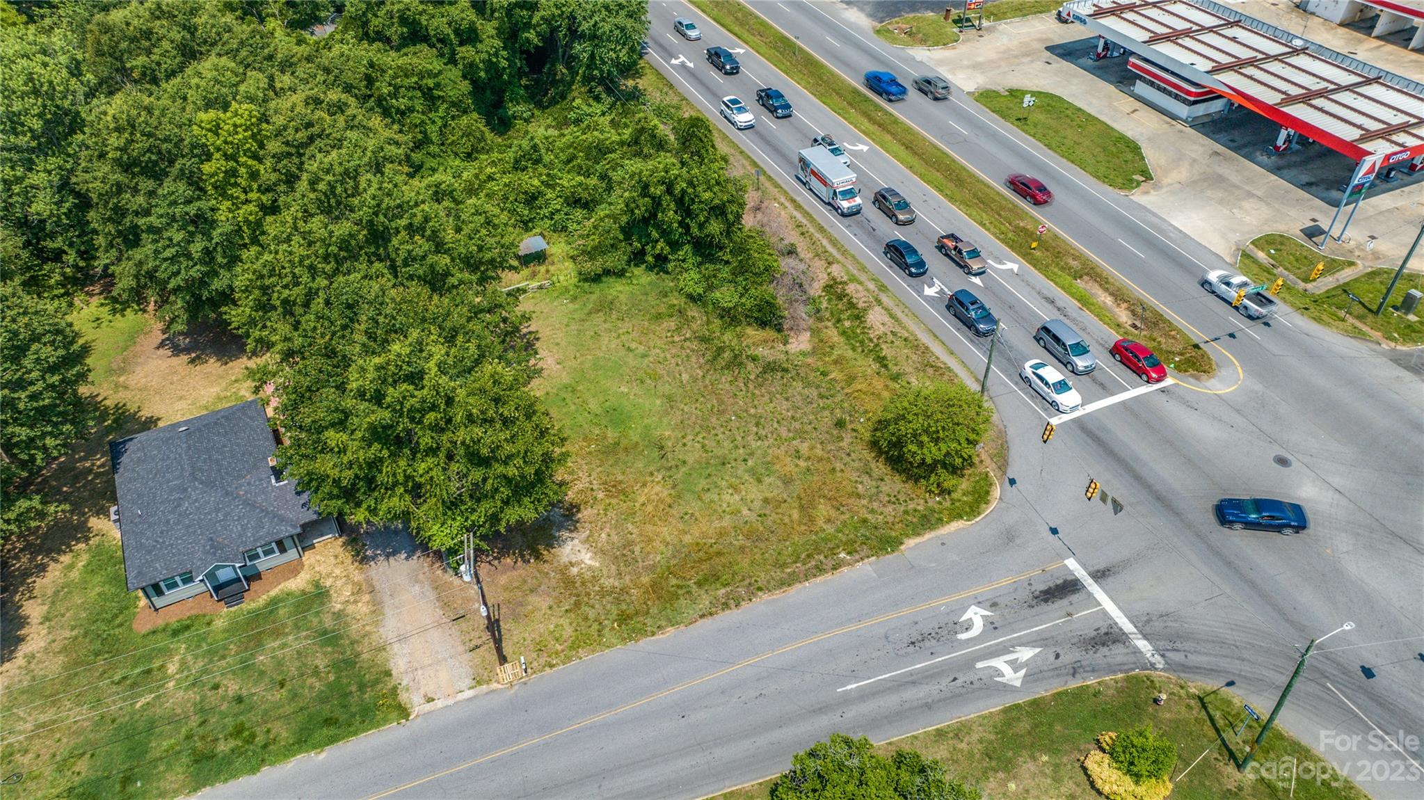 an aerial view of a residential houses with outdoor space