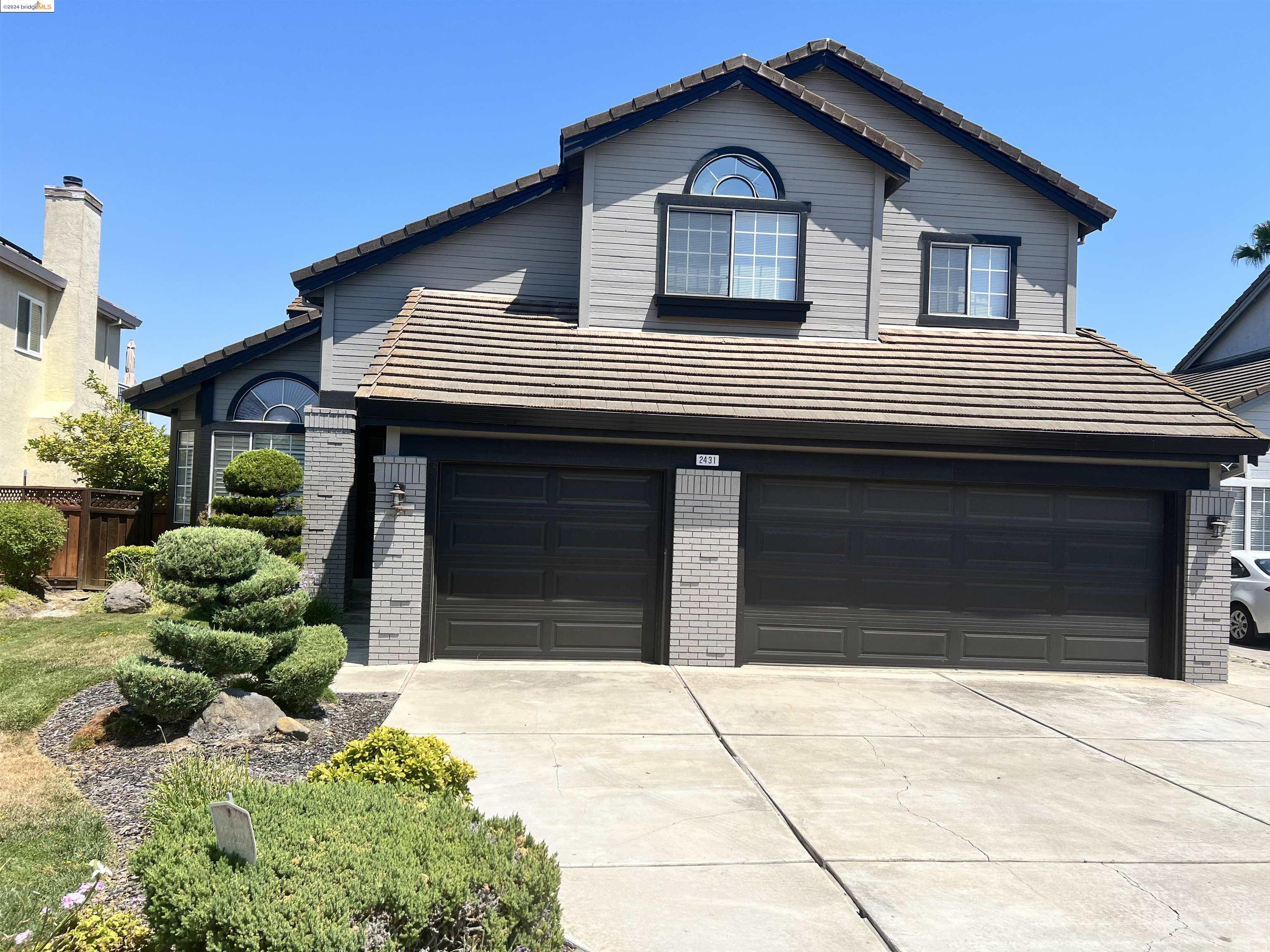 a front view of a house with a garage