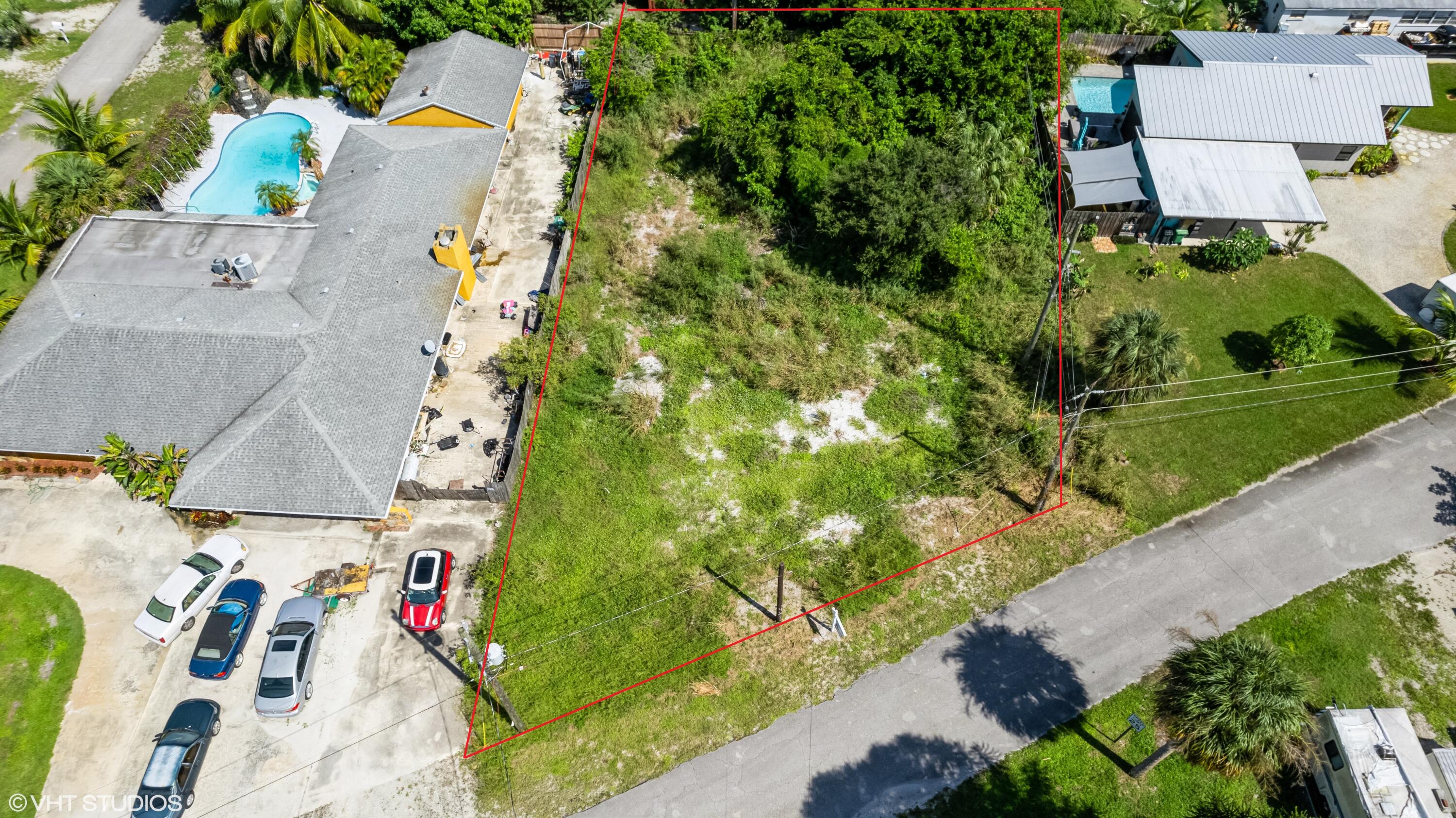 an aerial view of multiple houses with yard