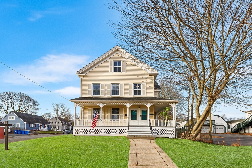 front view of a house with a yard